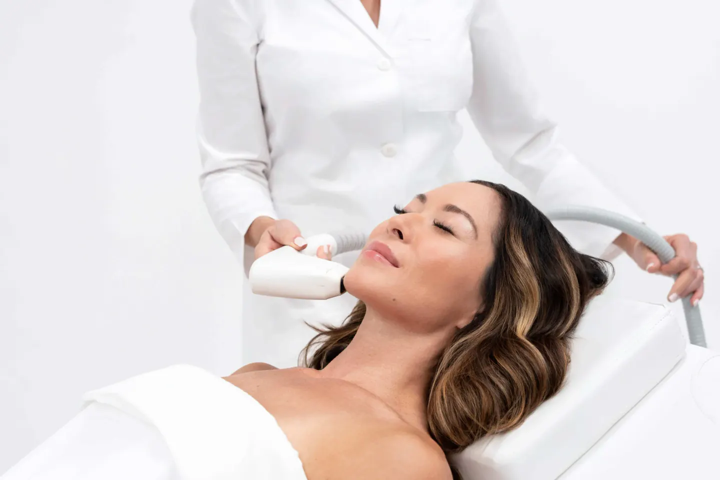 A patient receiving Sofwave ultrasound treatment, available at Square Mile Clinic, City of London